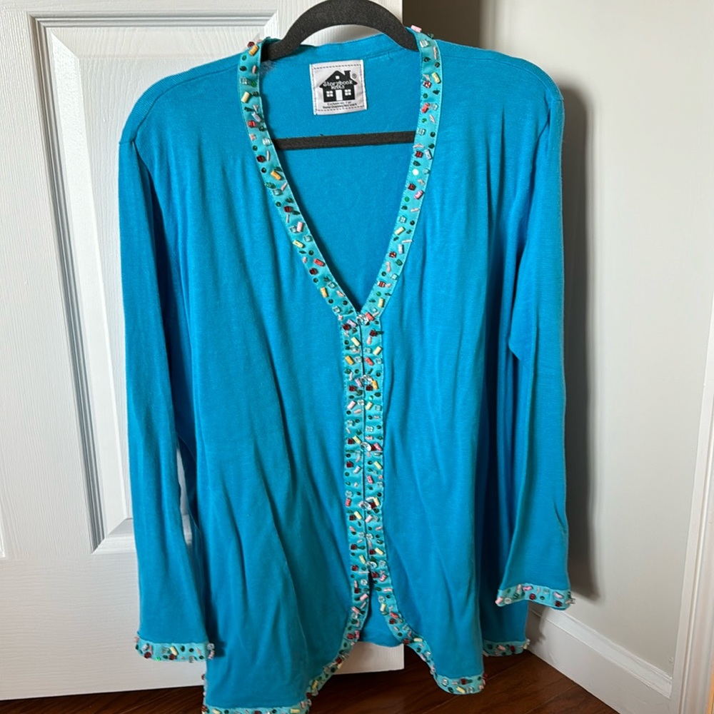 Turquoise sweater with beading